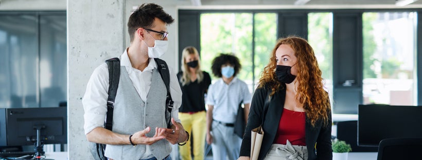 Young people wearing masks at work