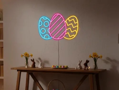 Colorful Easter egg neon sign mounted on a wall with table decorations and bunny figurines.