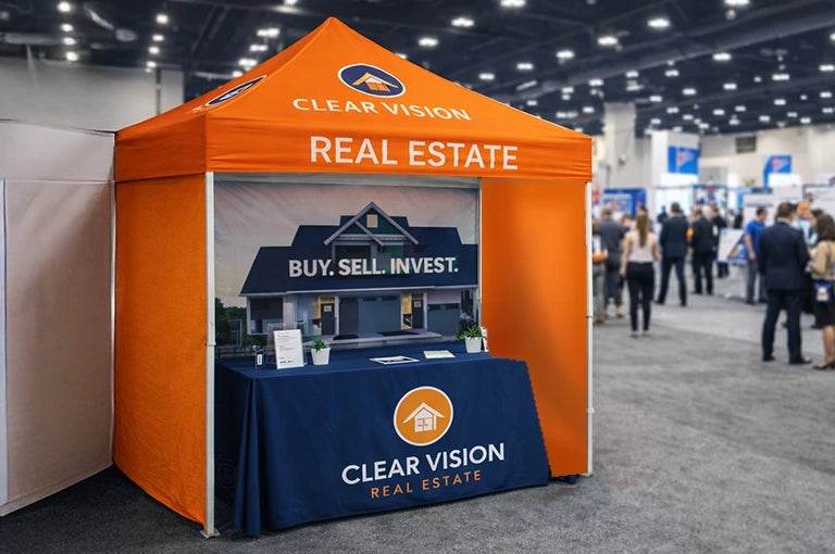 Trade show booth with a custom canopy tent and branded table setup for business promotion