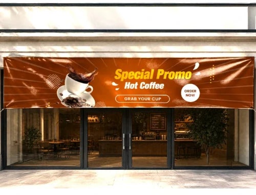 Vinyl banner printing for a cafe marketing campaign with a hot coffee offer and bold typography