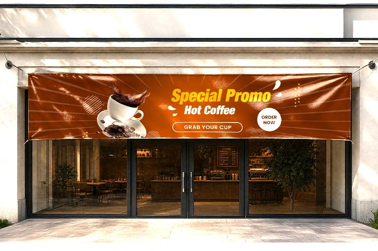 Vinyl banner printing for a cafe marketing campaign with a hot coffee offer and bold typography